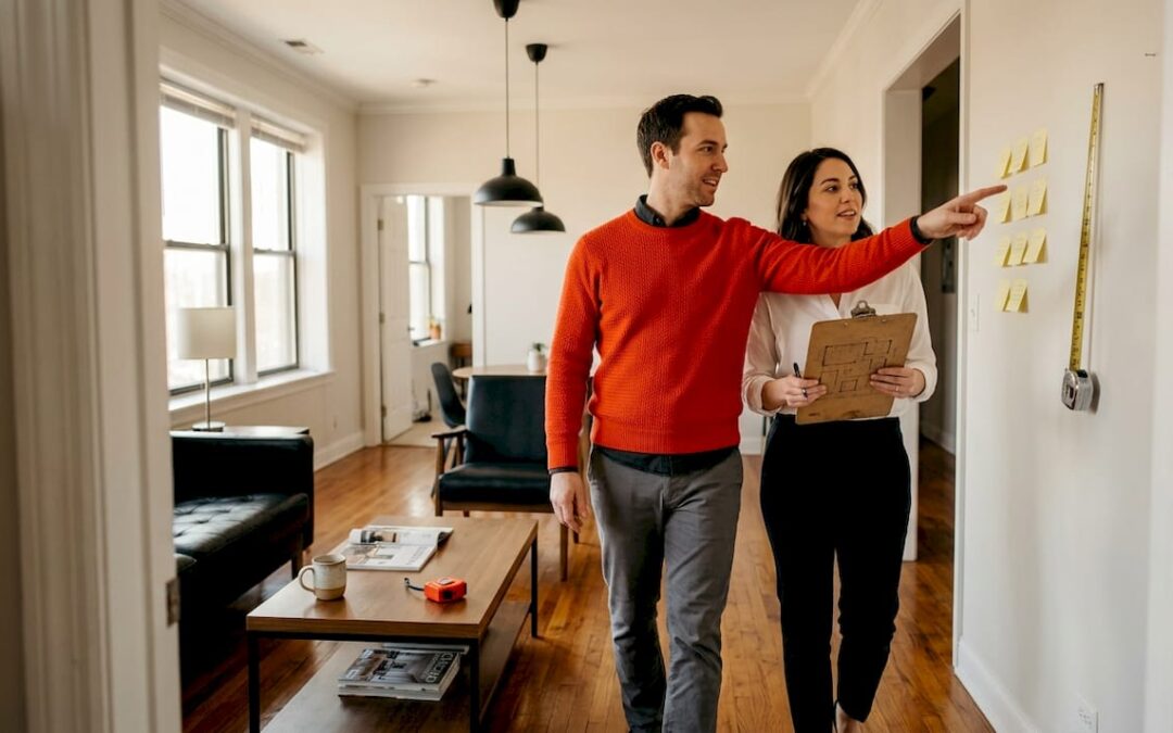 Couple reviewing apartment for remodel decisions